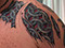 chain mail armour tattoo colour torn flesh skin ink colour tattooed men color